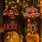 Spooksy™ 4-Pack Halloween Lighted Window Silhouette Lights, LED Hanging Ornaments with Cobweb, Pumpkin, Cat and Skull Designs