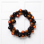 Spooksy™ Northlight Spiders and Ornaments Small Tinsel Halloween Wreath - 18" - Orange and Black - Unlit